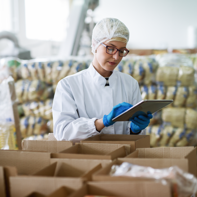 Factory-worker-ensuring-compliance