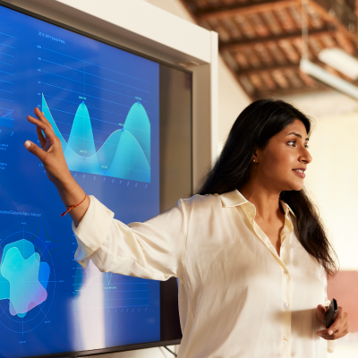 Woman presenting blue data.